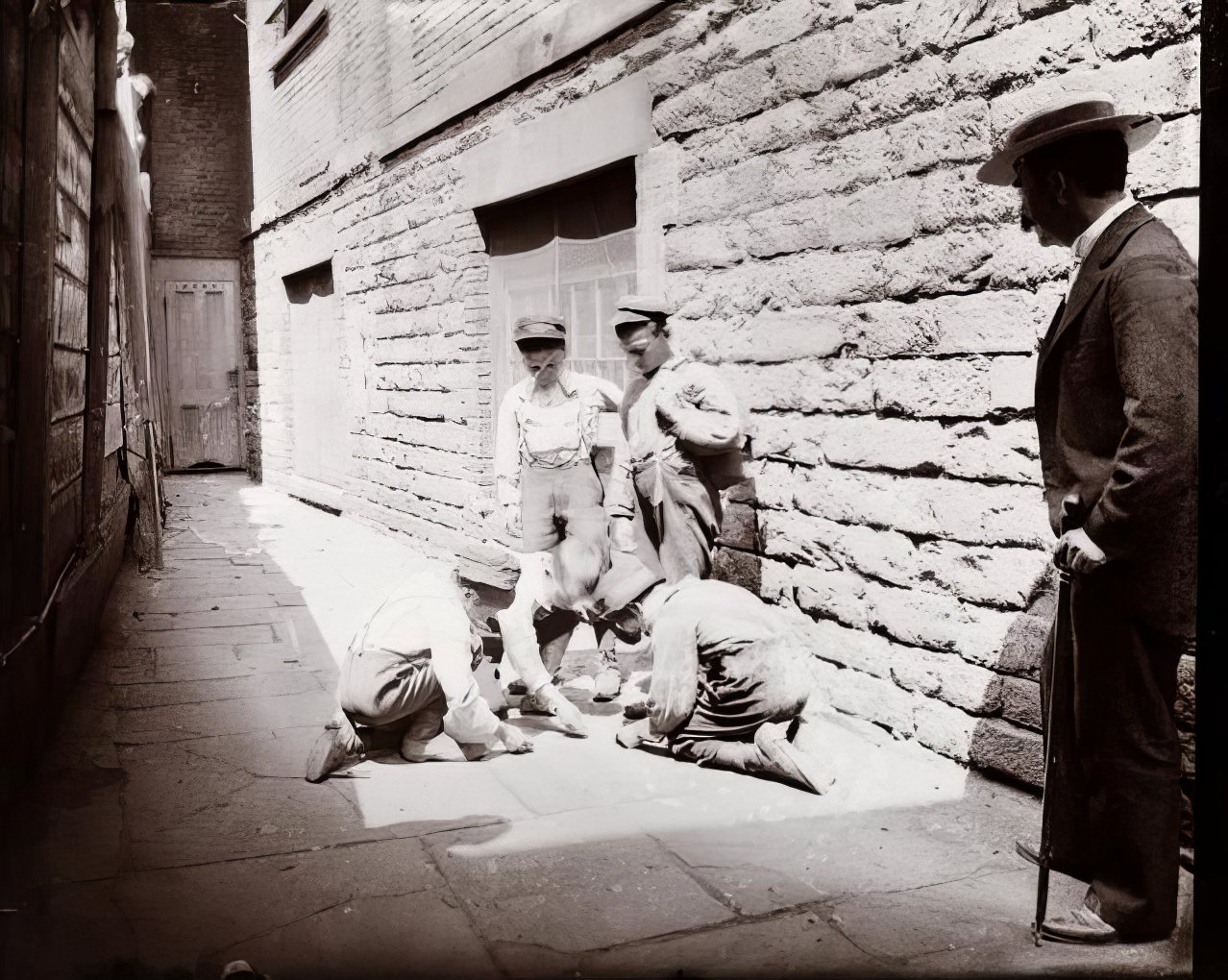 Bootblacks and newsboys shooting craps, 1894.