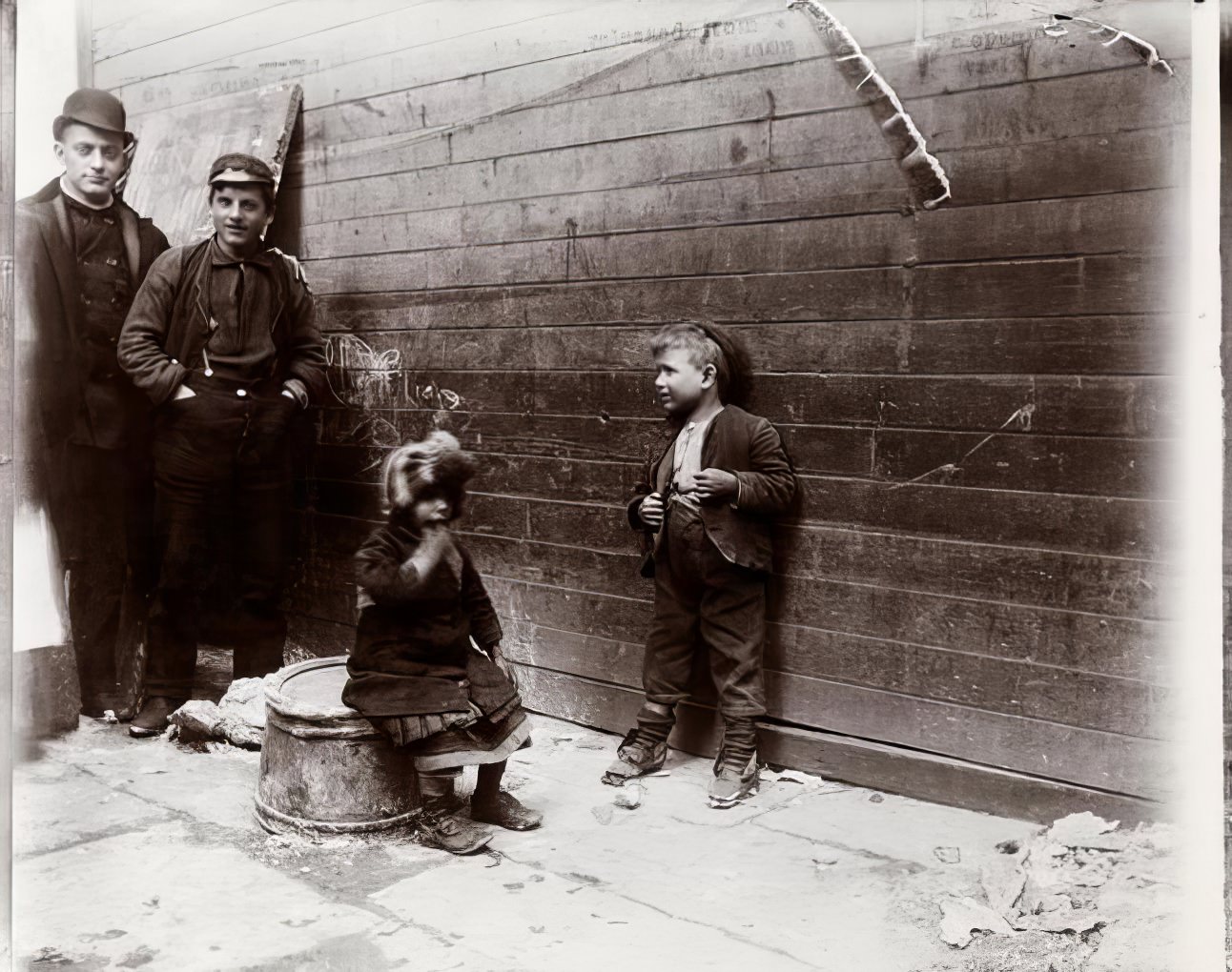 Two Greek children in Gotham Court debating Santa Claus, 1891.