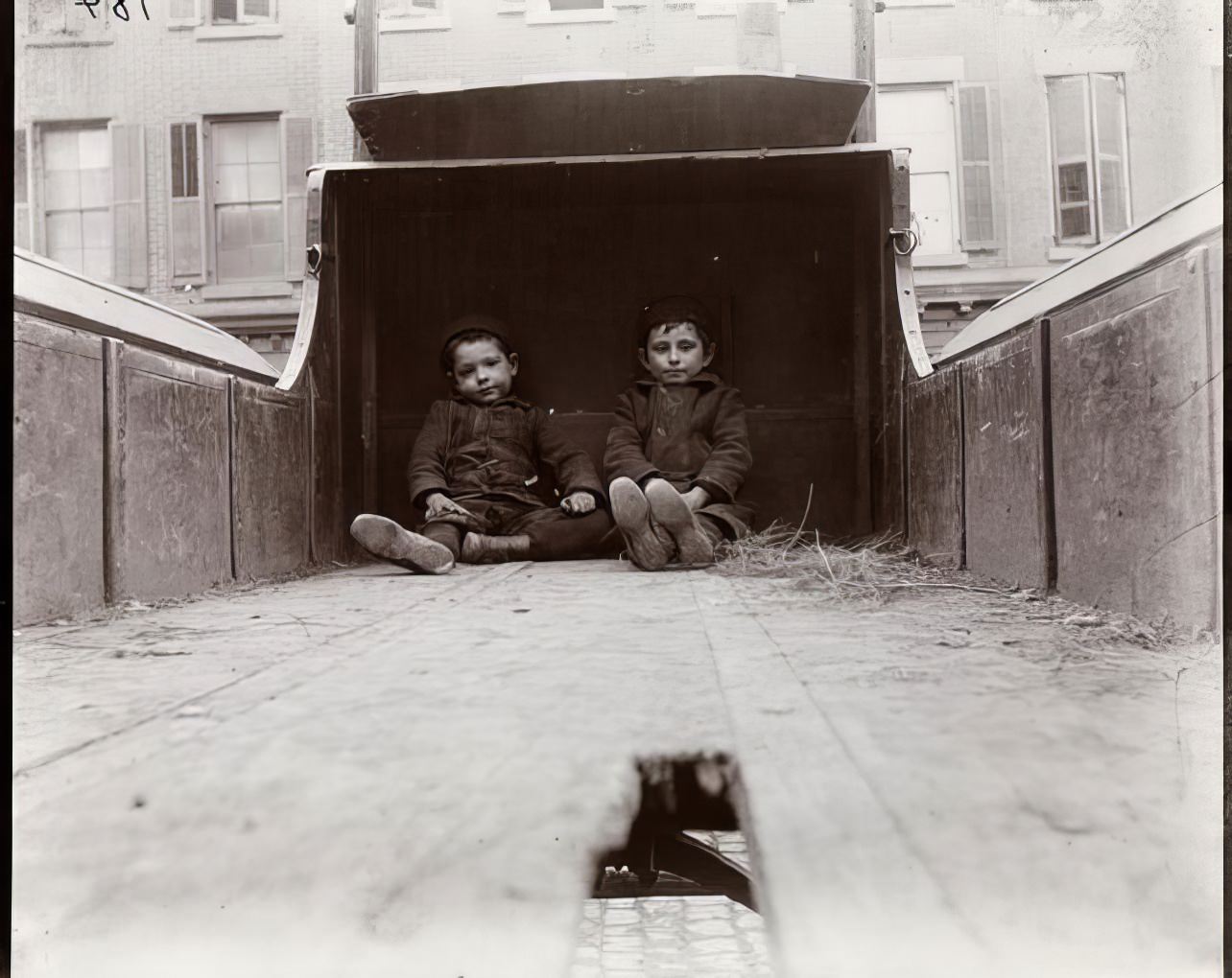 Children playing on a truck on Baxter Street, 1891.