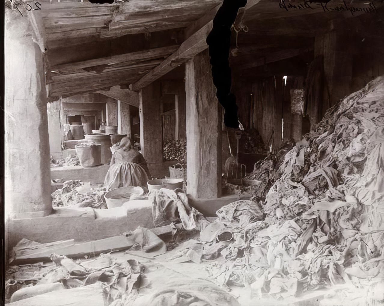 A woman working at the Rivington Street Dump, 1891.