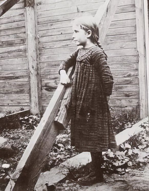 A girl performing in a playground, 1895.