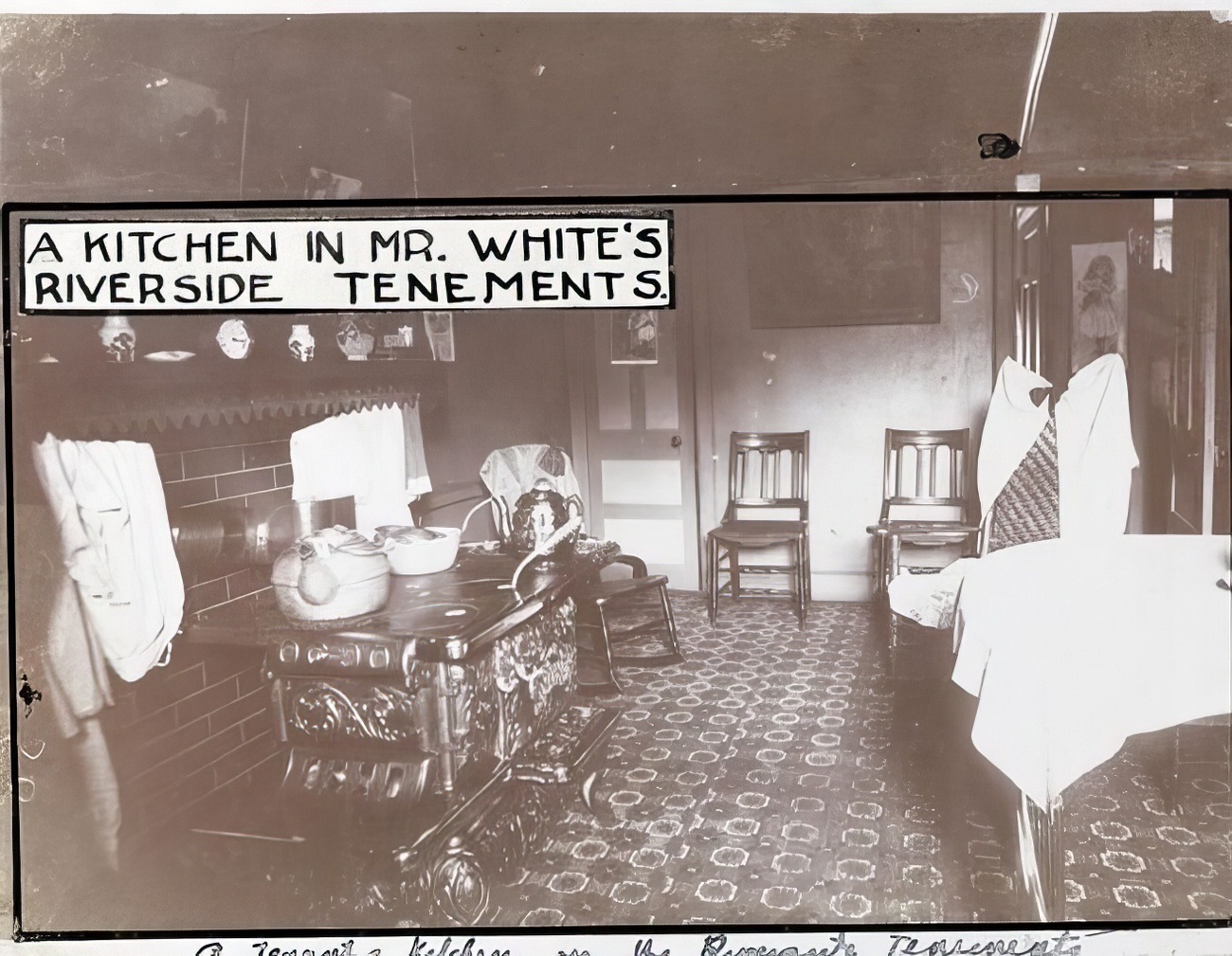 A kitchen in Mr. White's Riverside tenements, 1900s.