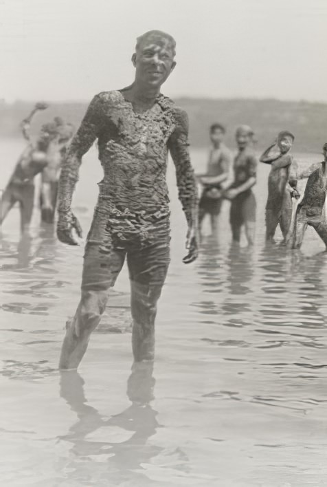 A young man covered in mud, 1914.