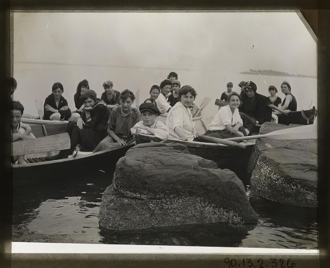 Young people in rowboats, 1914.