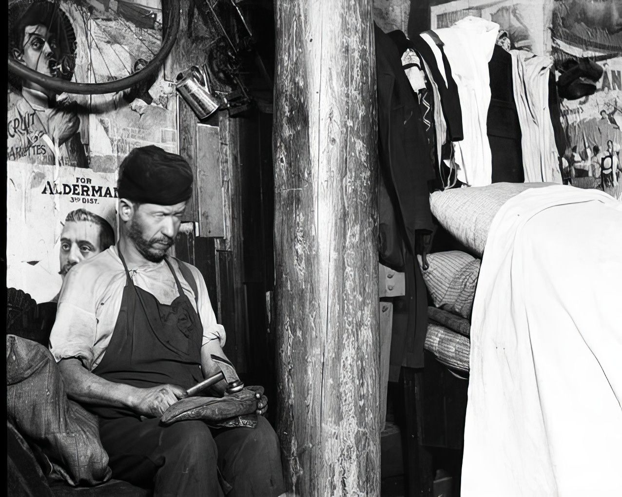 A shoemaker in Broome Street, 1890s.