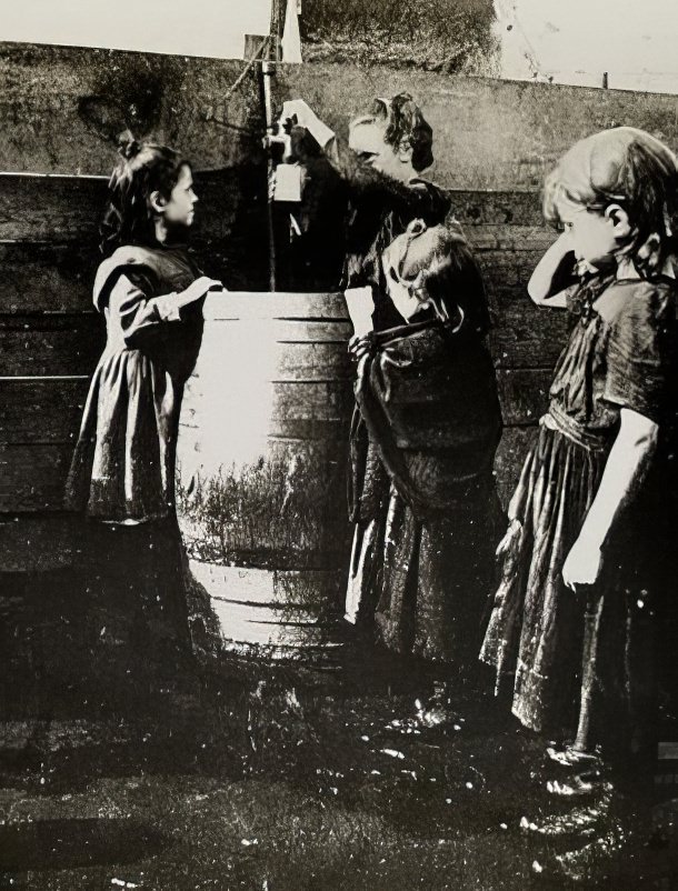 Children safe from police in a West Side playground, 1895.