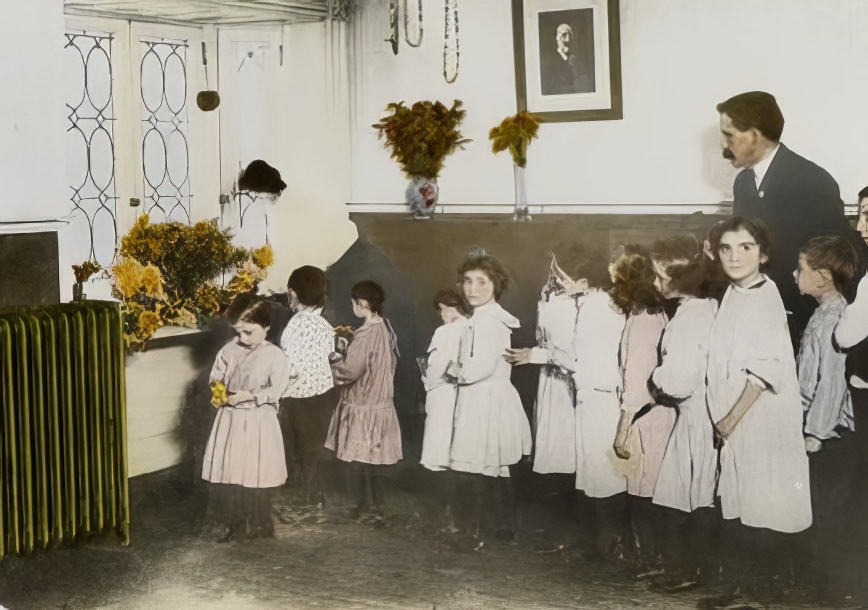 Man and woman with group of young children, circa 1891.