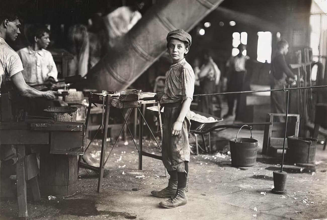 A carrying-in-boy in a Virginia glass factory, 1911.