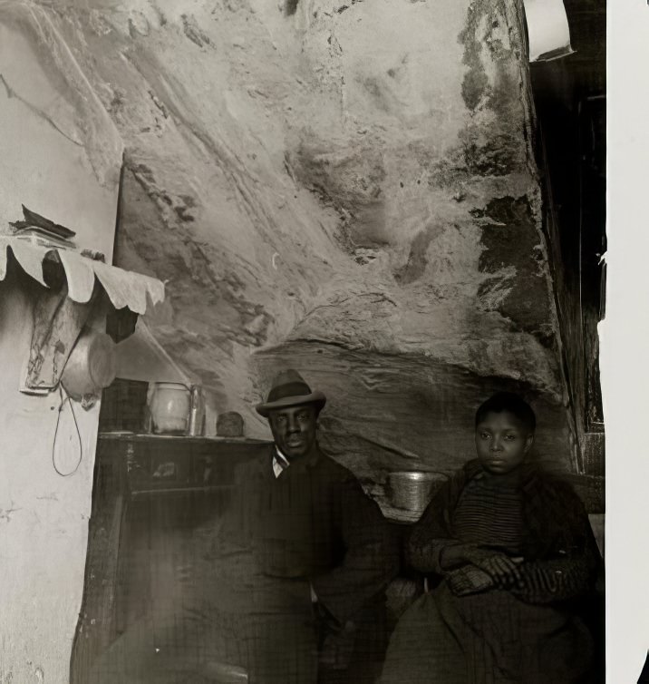 Black couple in their home, circa 1895.