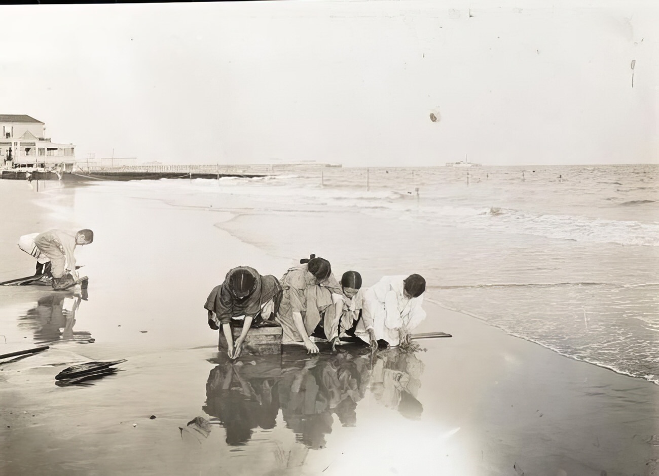 Playing by the water, circa 1895.