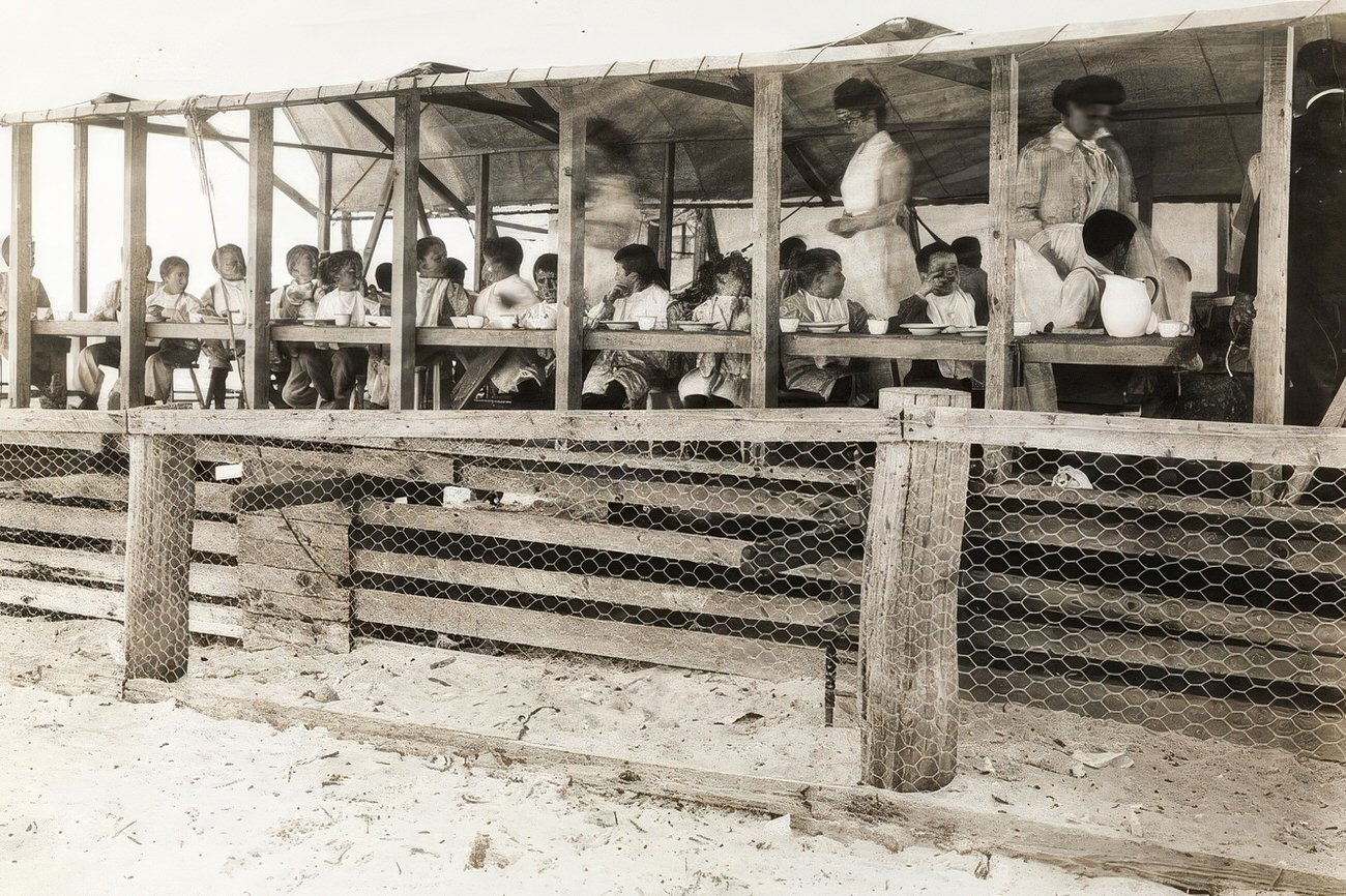 Having lunch, circa 1895.