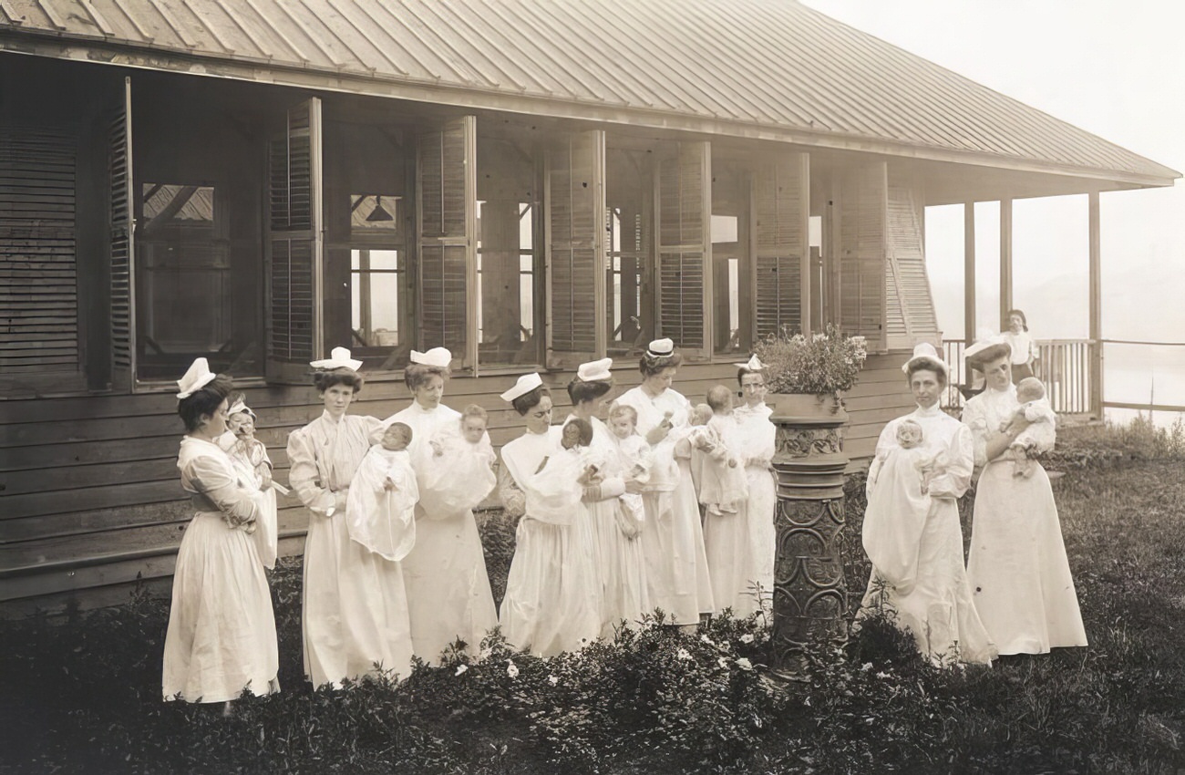 Nurses and babies, circa 1895.