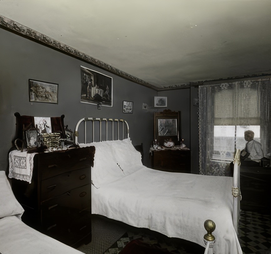 A bedroom in Riverside Buildings, Brooklyn, 1890s.