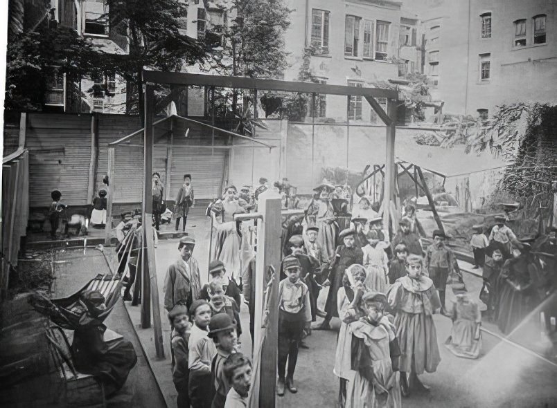 A backyard playground at a settlement house on Henry Street, 1890s.