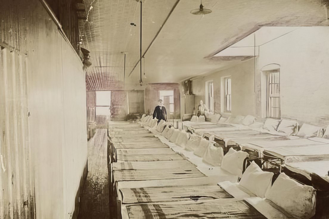 A bedroom in the New City Lodging House, 1900.