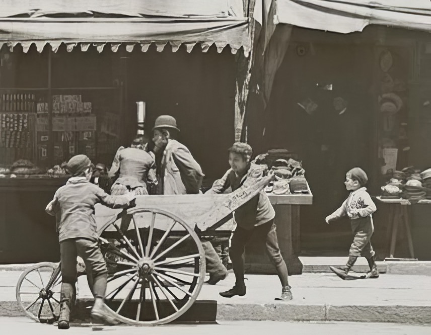 Children playing in a street playground, 1890s.