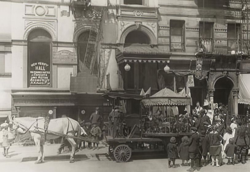 A horse-drawn merry-go-round, 1890s.