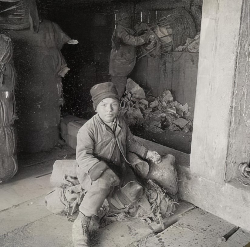 A child living near a dump, 1900.