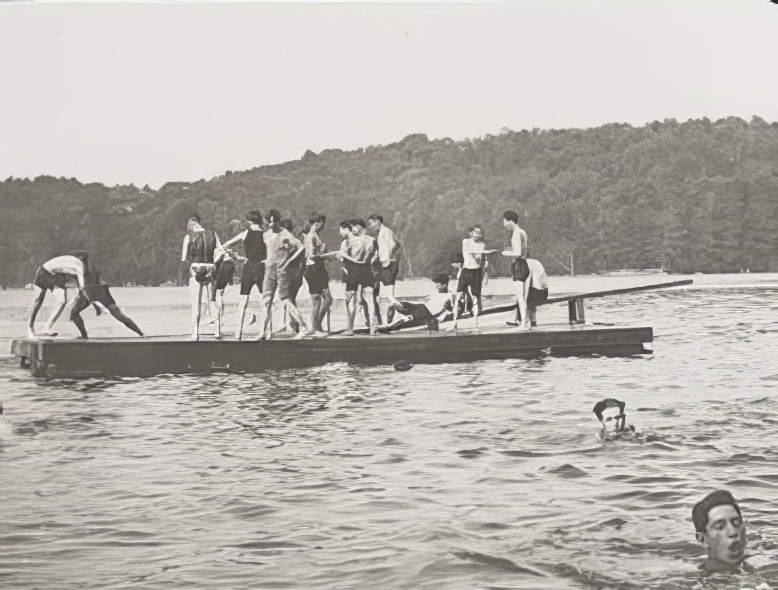 Children playing on a raft, 1900.