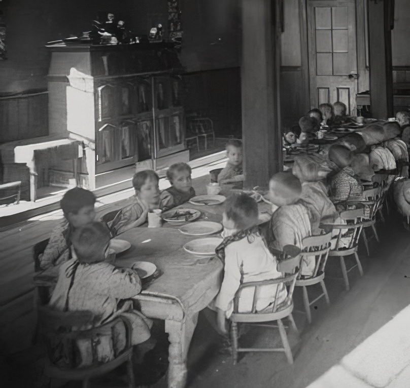 Babies at supper, 1890s.