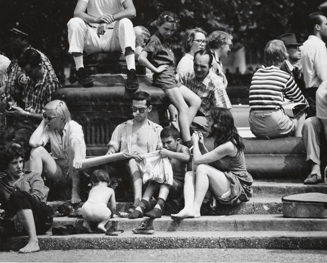 A child playing with shoes on the fountain steps in Washington Square Park, 1956.