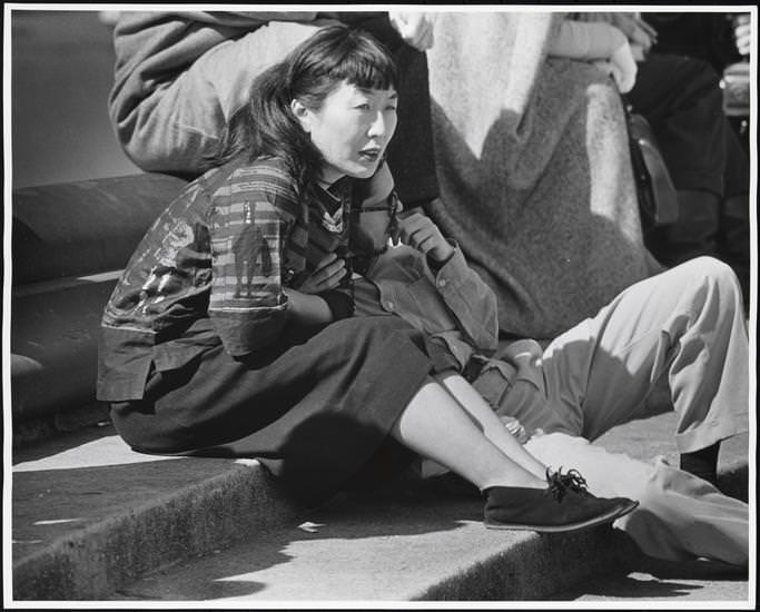 An Asian woman on the fountain steps, Washington Square Park, 1956.