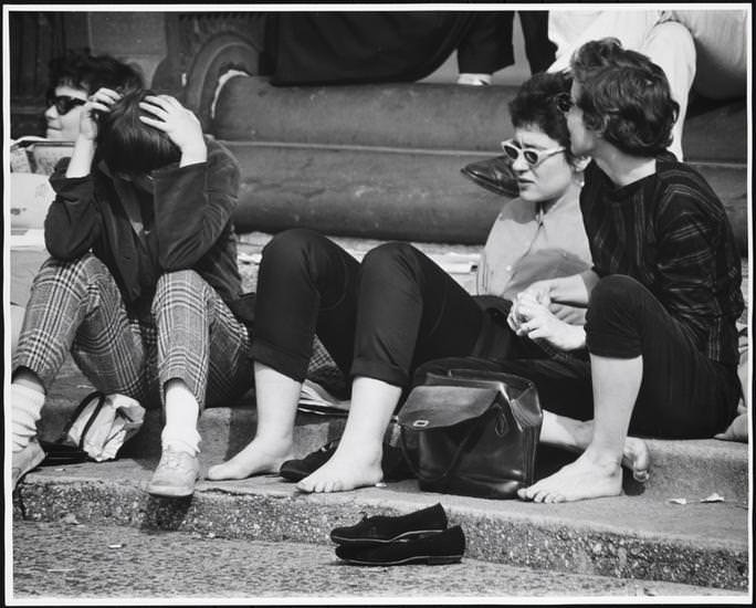 Barefoot girls with sunglasses on the fountain steps, Washington Square Park, 1956.