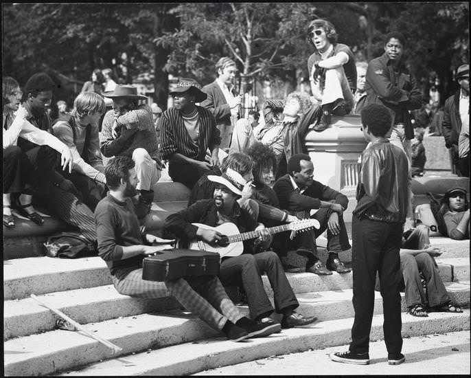 Sitting with a guitarist on the fountain steps, Washington Square Park, 1956.