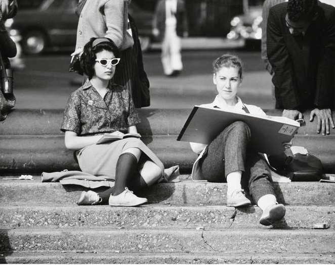 A girl with a sketchpad on the fountain steps, Washington Square Park, 1956.