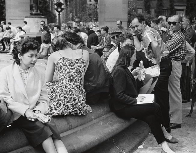 People eating ice cream on the fountain steps, Washington Square Park, 1956.