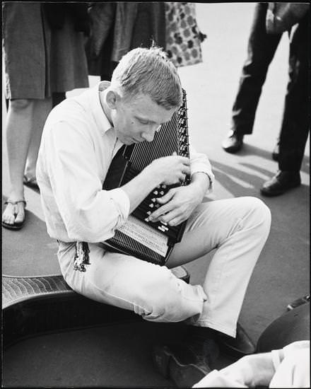 A man playing an autoharp in Washington Square Park, 1956.