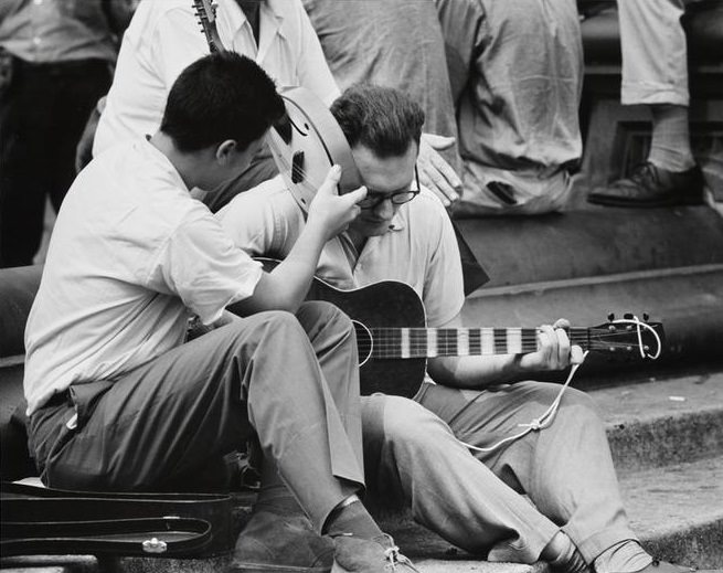 A man holding a mandolin sitting with a guitarist in Washington Square Park, 1956.