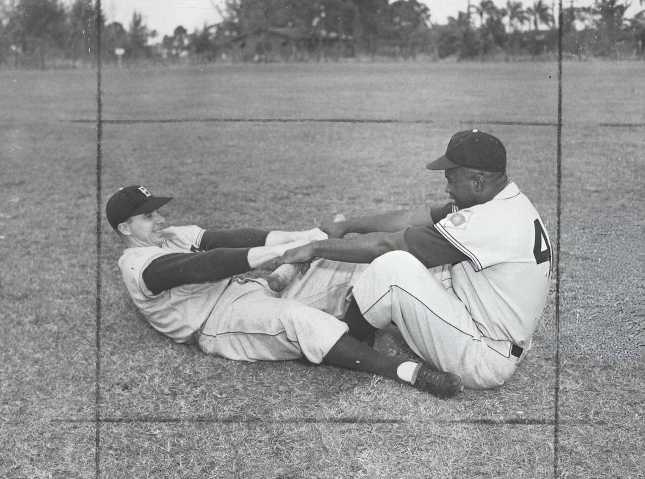 Jackie Robinson and teammate warming up, 1948.