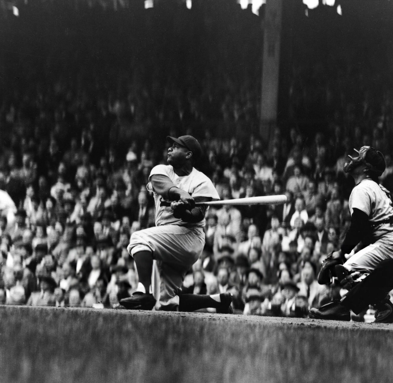 Roy Campanella hitting a ball, 1950s.