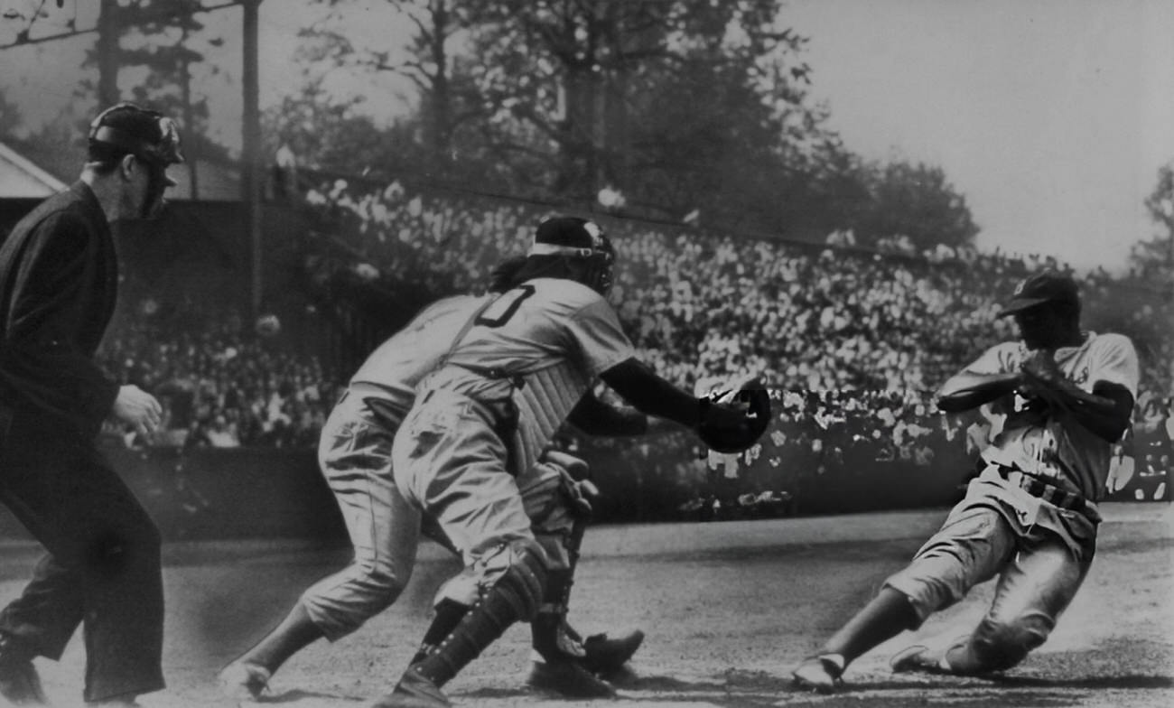 Jackie Robinson stealing home, 1948.