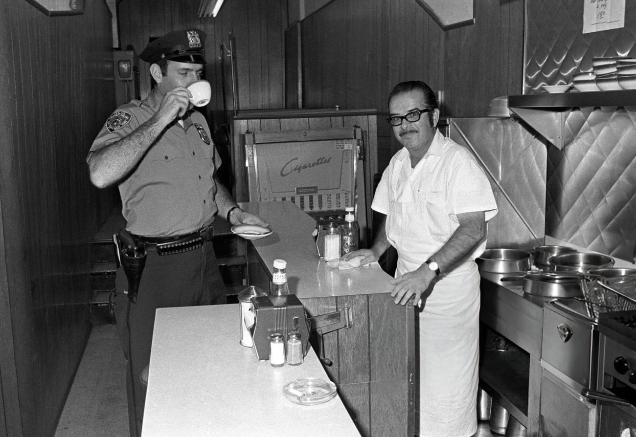 Manhattan stops for coffee in a diner.