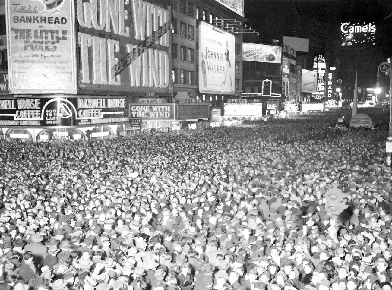 Times Square filled with celebrators on New Year's Eve, 1930s.