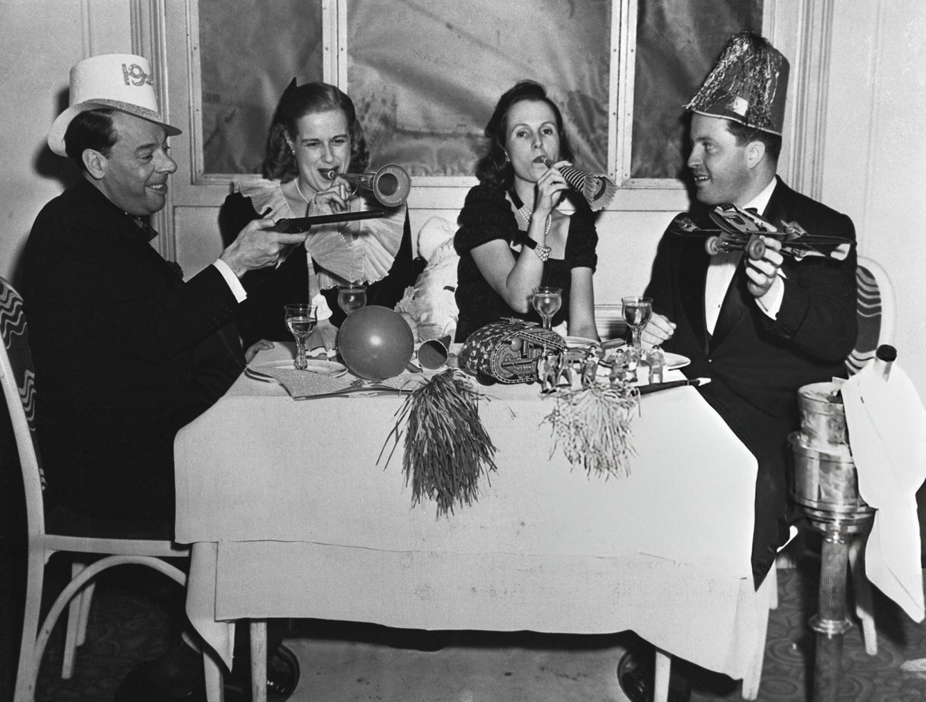 People with party favors at a New Year's party at the Club Versailles, New York City, 1940.