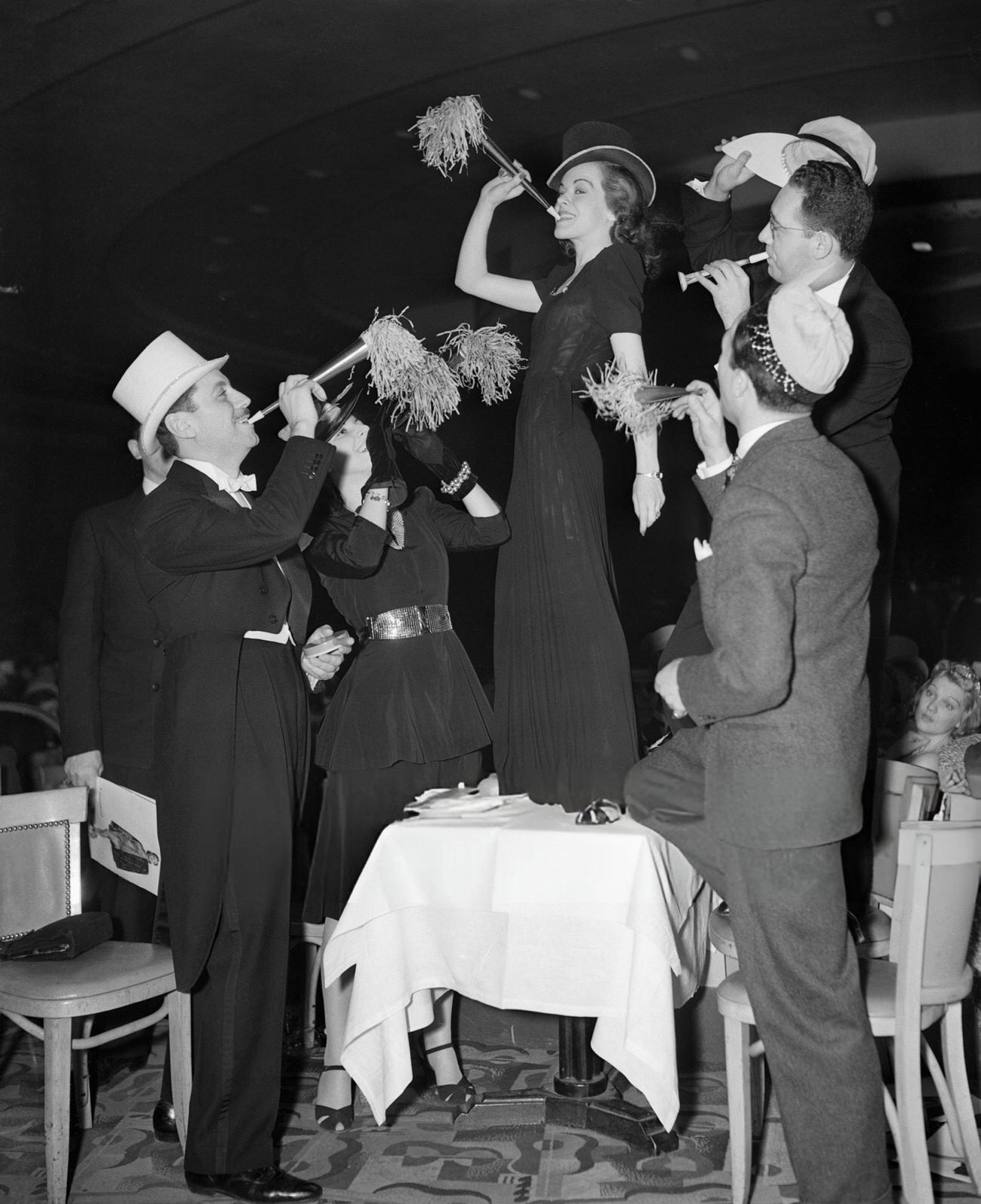 A woman on a table celebrating New Year's Eve at the International Casino, New York City, 1940.