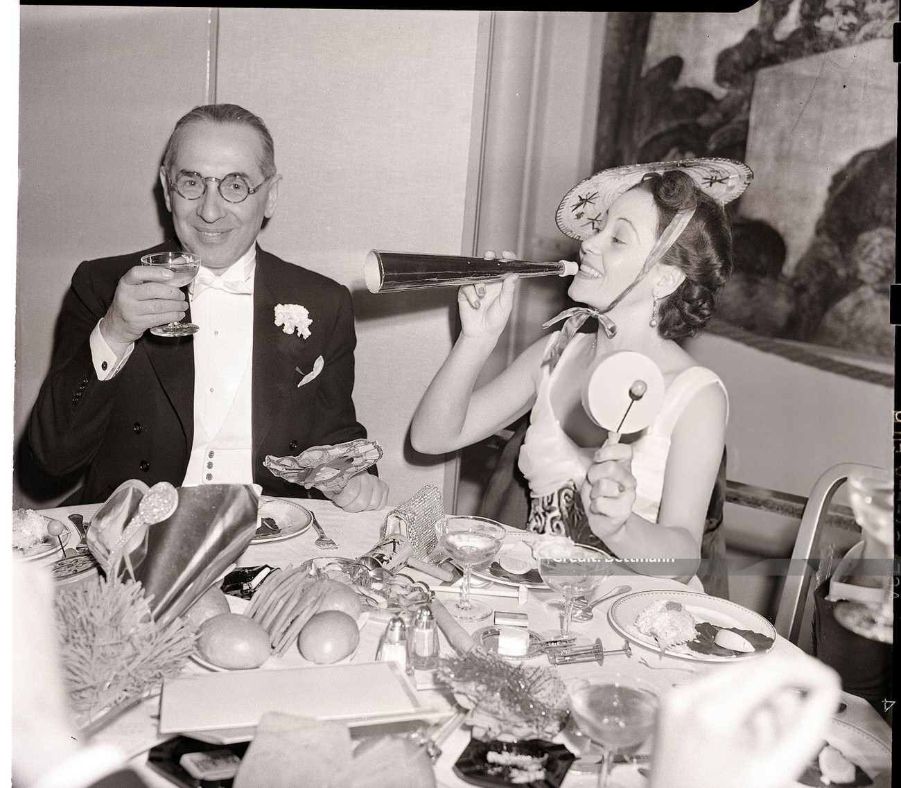 Alfonso Lopez and Senora Emilio Toro in the Sert Room of the Waldorf-Astoria, New York City, 1940.