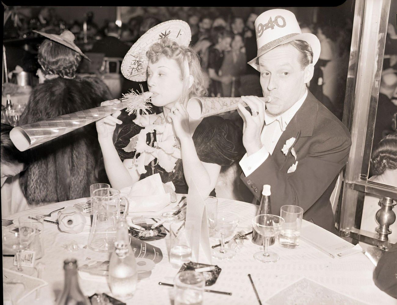 Florence Sundsrrom and Ronald Graham celebrating New Year's Eve at the Sert Room of the Waldorf-Astoria, New York City, 1940.