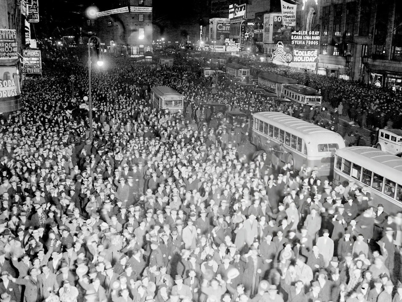 Times Square packed with people celebrating New Year's Eve, 1936.