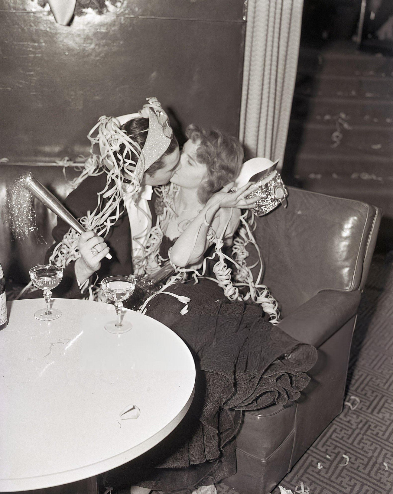 Captain Sol Gerson and Miss Gertrude Holtorf kissing at the Rainbow Room, New York City, 1940.