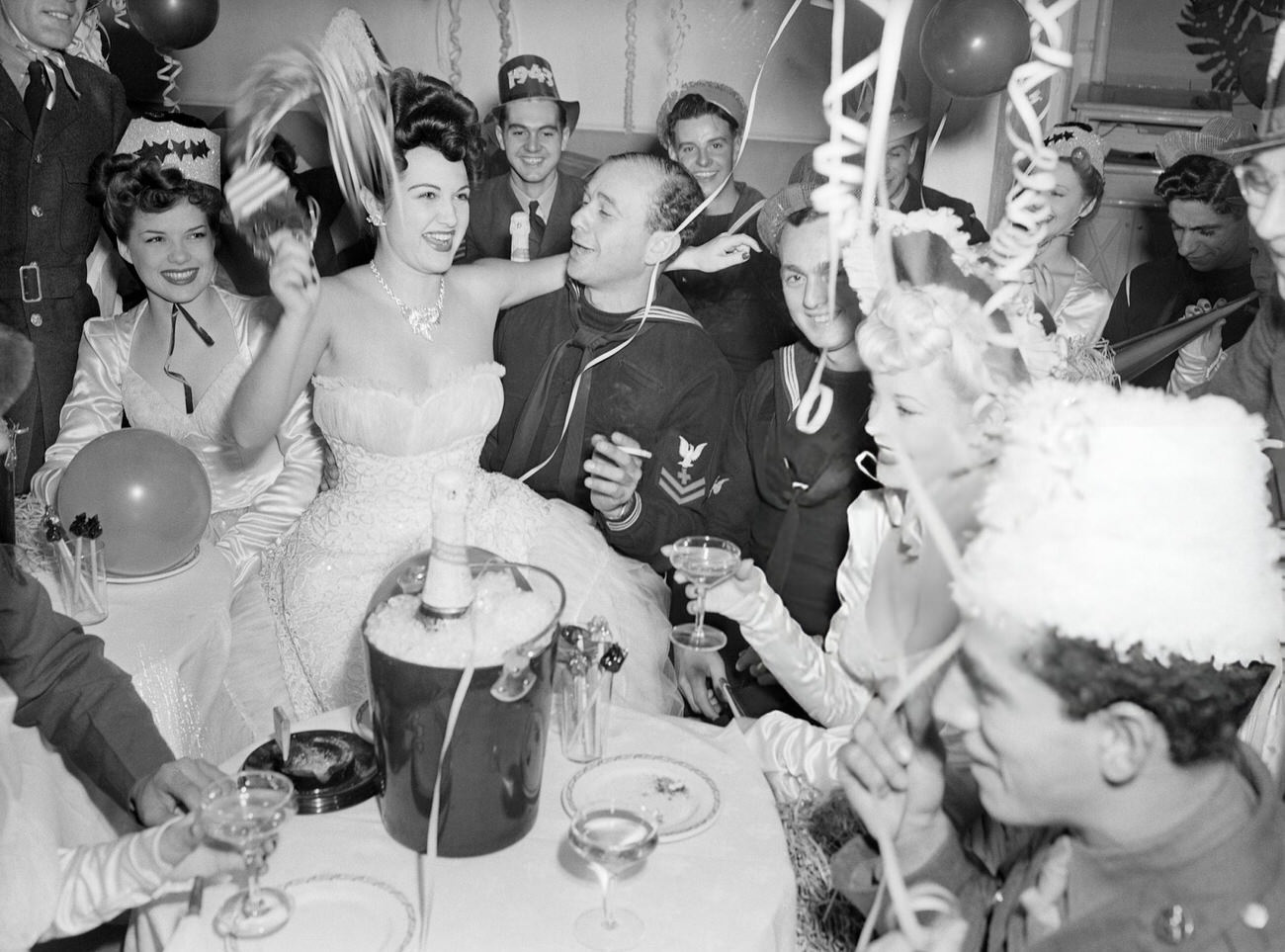 Soldiers and showgirls celebrating New Year's Eve, New York City, 1941.