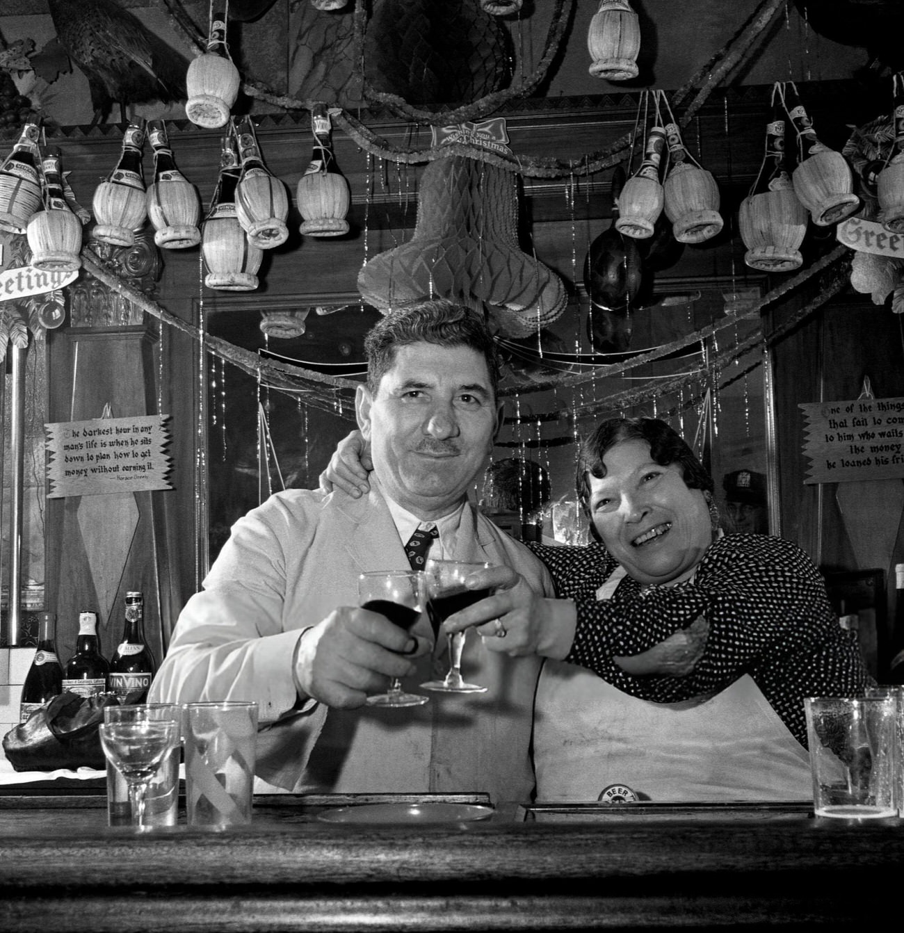 Mr. and Mrs. Di Costanzo toasting the New Year at their restaurant, New York City, 1942.