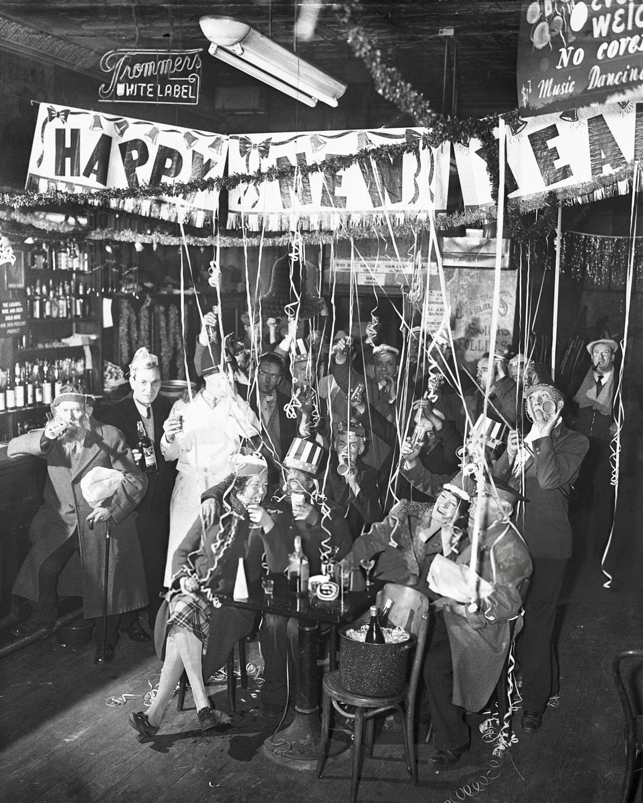 Sammy Fuchs's New Year's Eve celebration for men on the Bowery, New York City, 1944.