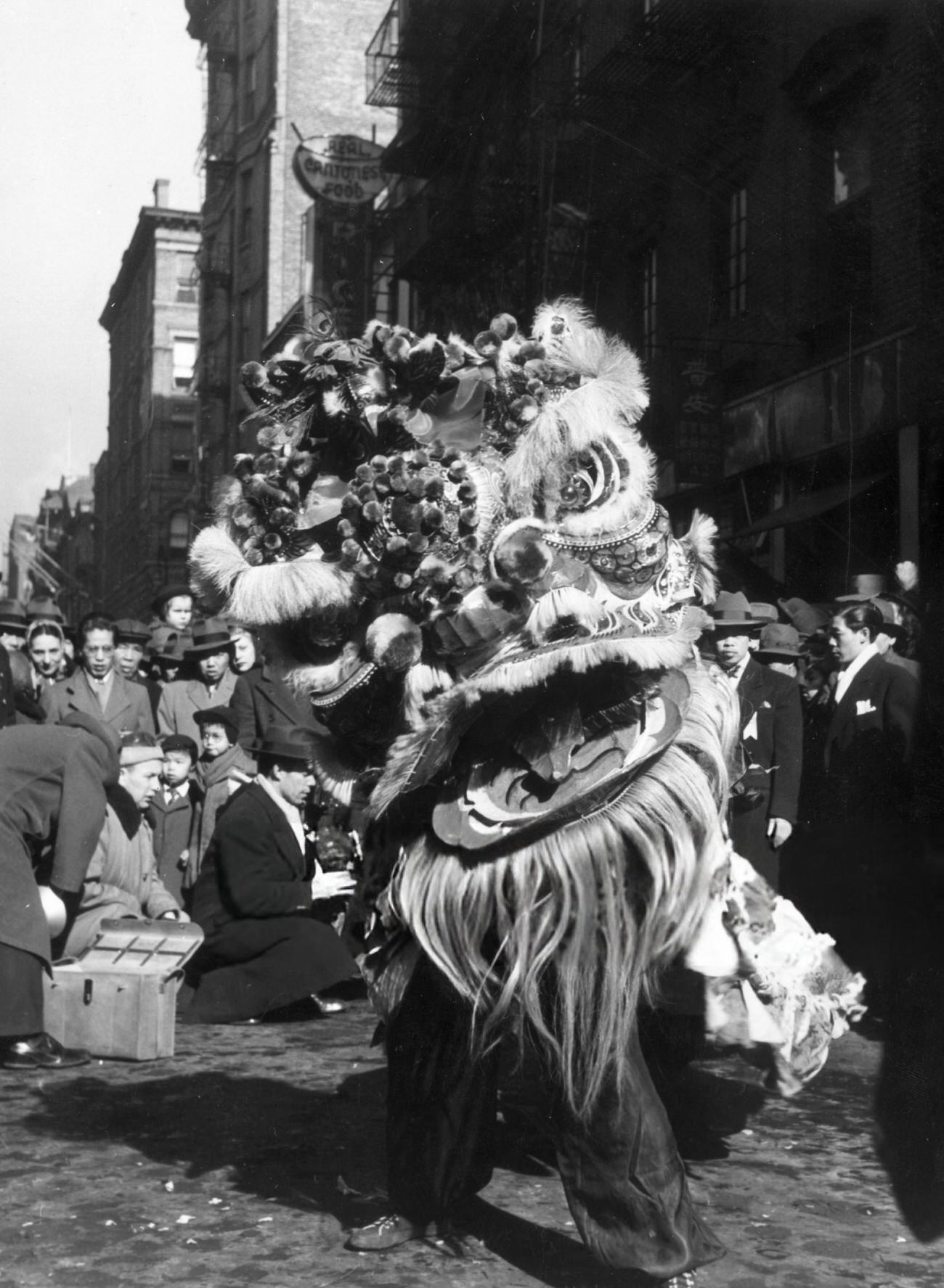 Person wearing a Chinese dragon head mask in the Chinese New Year's Parade, Chinatown, New York City, 1945.