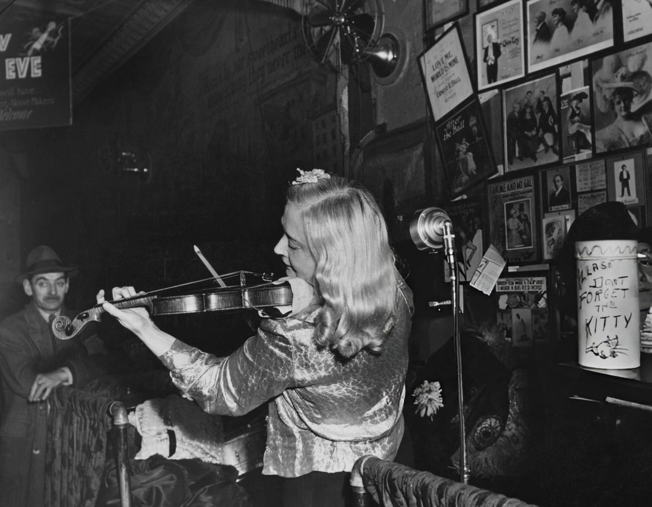 A woman playing the violin at Sammy's Bowery Follies, New York City, 1945.