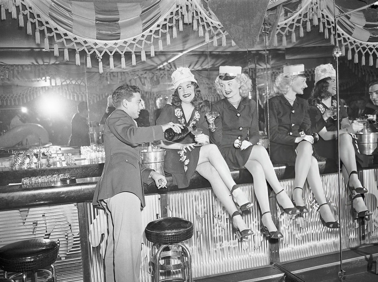 People drinking champagne at a New Year's celebration at the Diamond Horseshoe, New York City, 1940s.