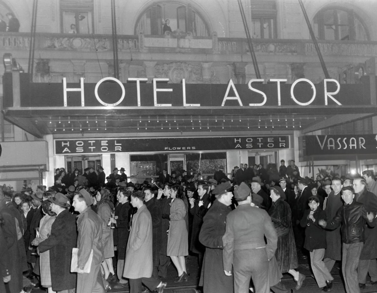 New Year's celebrants walking outside the Waldorf Astoria, New York City, 1946.